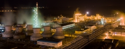 panorama of large chemical plant at night with light